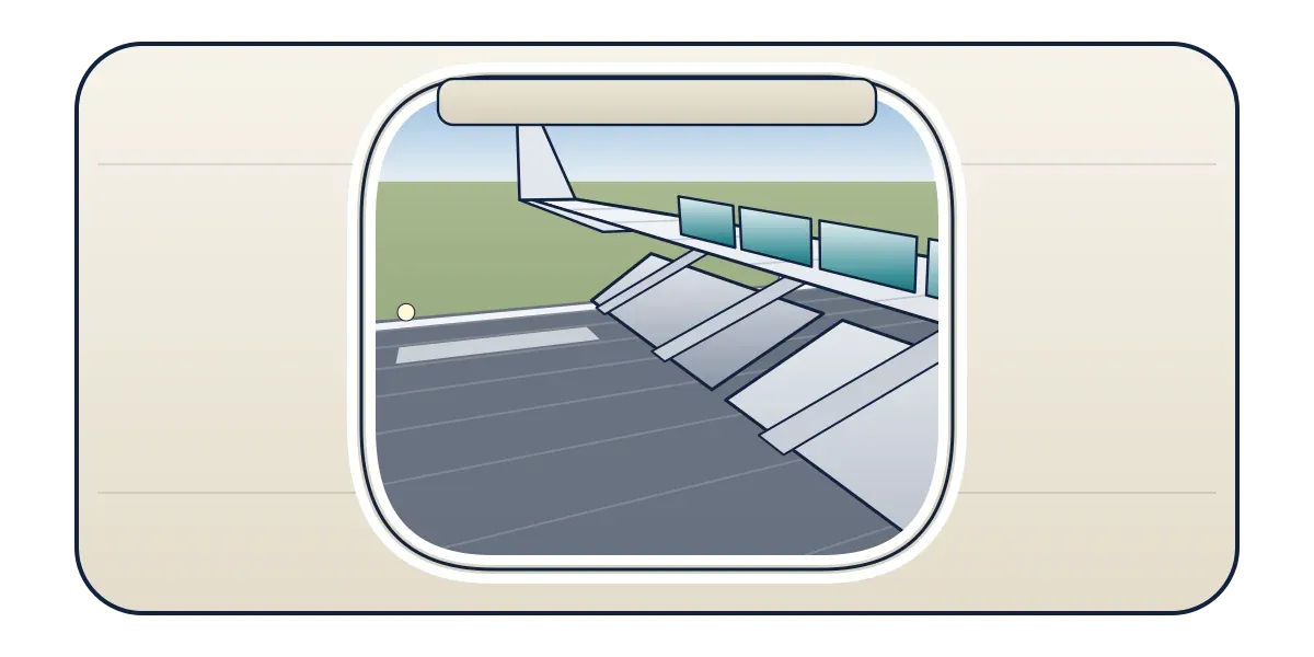 The view through a cabin window of a wing on the runway with its spoiler panels raised and flaps hanging down behind