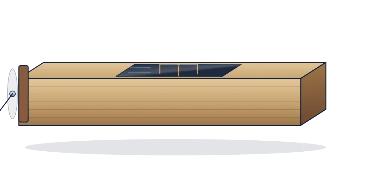 A long wooden box wind tunnel with a fan at one end and a small glass window on top showing a test wing on a balance